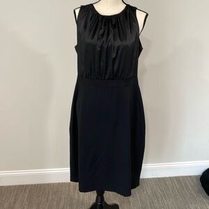 Sleeveless black satin top with black bottom dress. Beautiful dress for curves.
